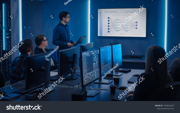 stock-photo-team-of-professional-it-developers-have-meeting-speaker-talks-about-new-blockchain-based-software-1590826207.jpg
